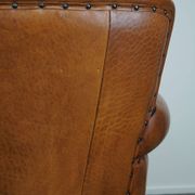 Fauteuil en cuir de mouton à l'aspect luxueux