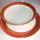 Plate and limoges porcelain dish with orange and gold trim