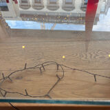 Gae Aulenti coffee table for Fontana Arte, transparent glass top with black cast iron supports, 1980s.