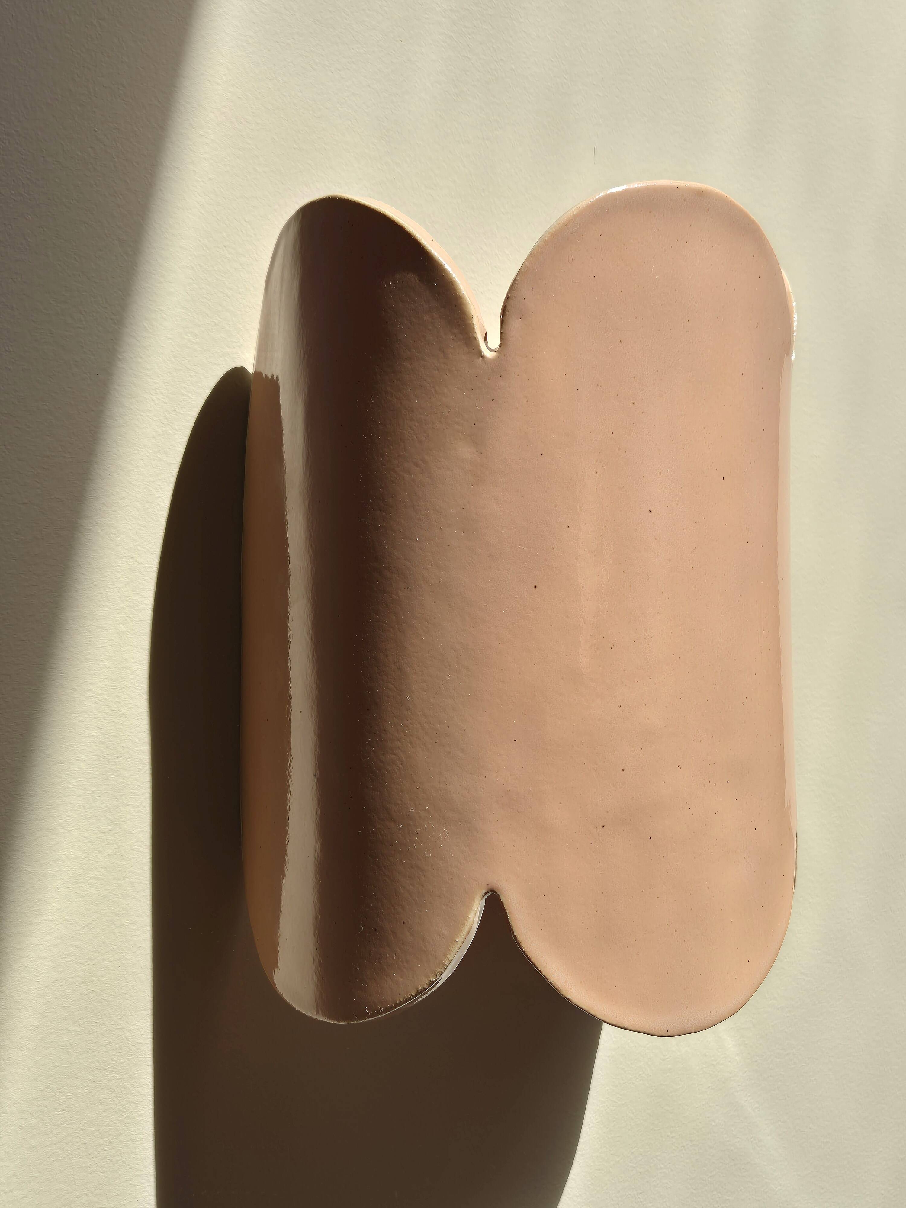 Mocha enamelled stoneware wall light (small model).