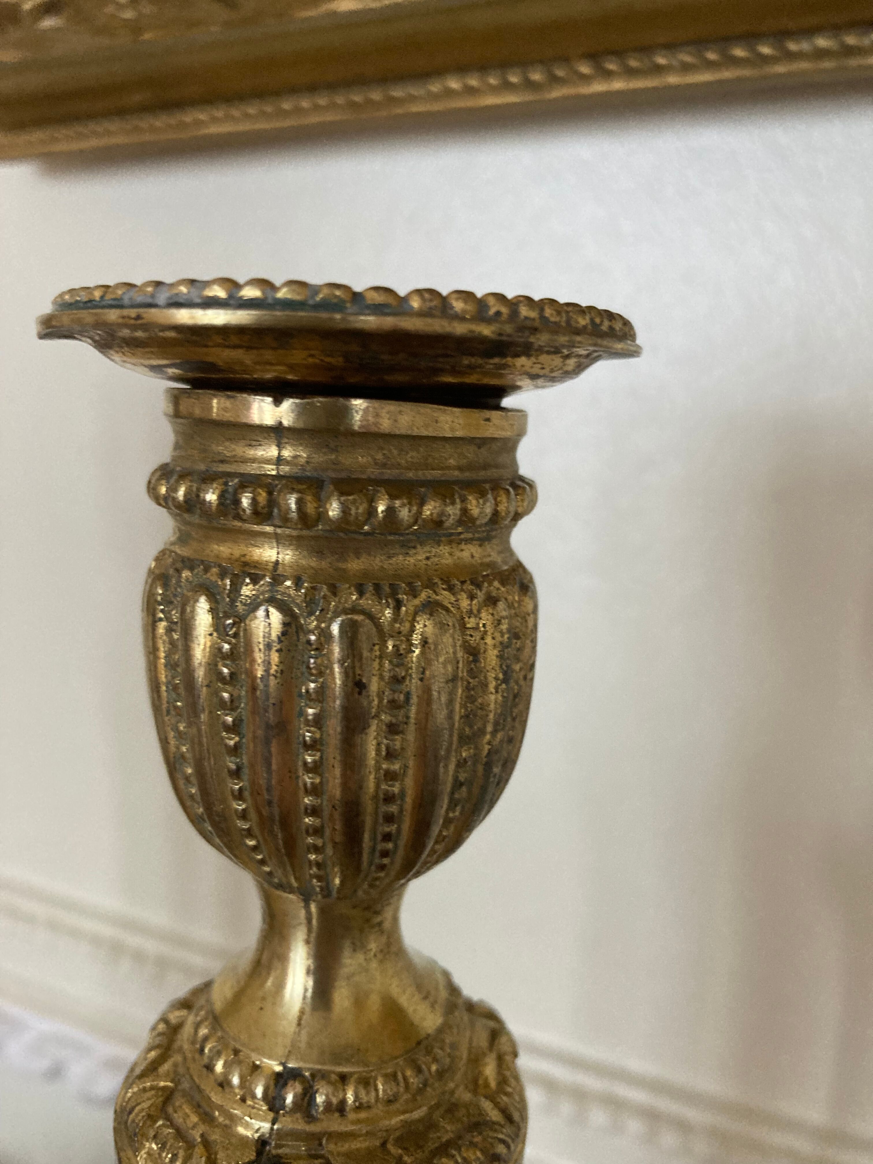 Pair of Louis XVI torch candlesticks in gilded bronze