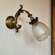 Bronze wall light with opaque glass tulip