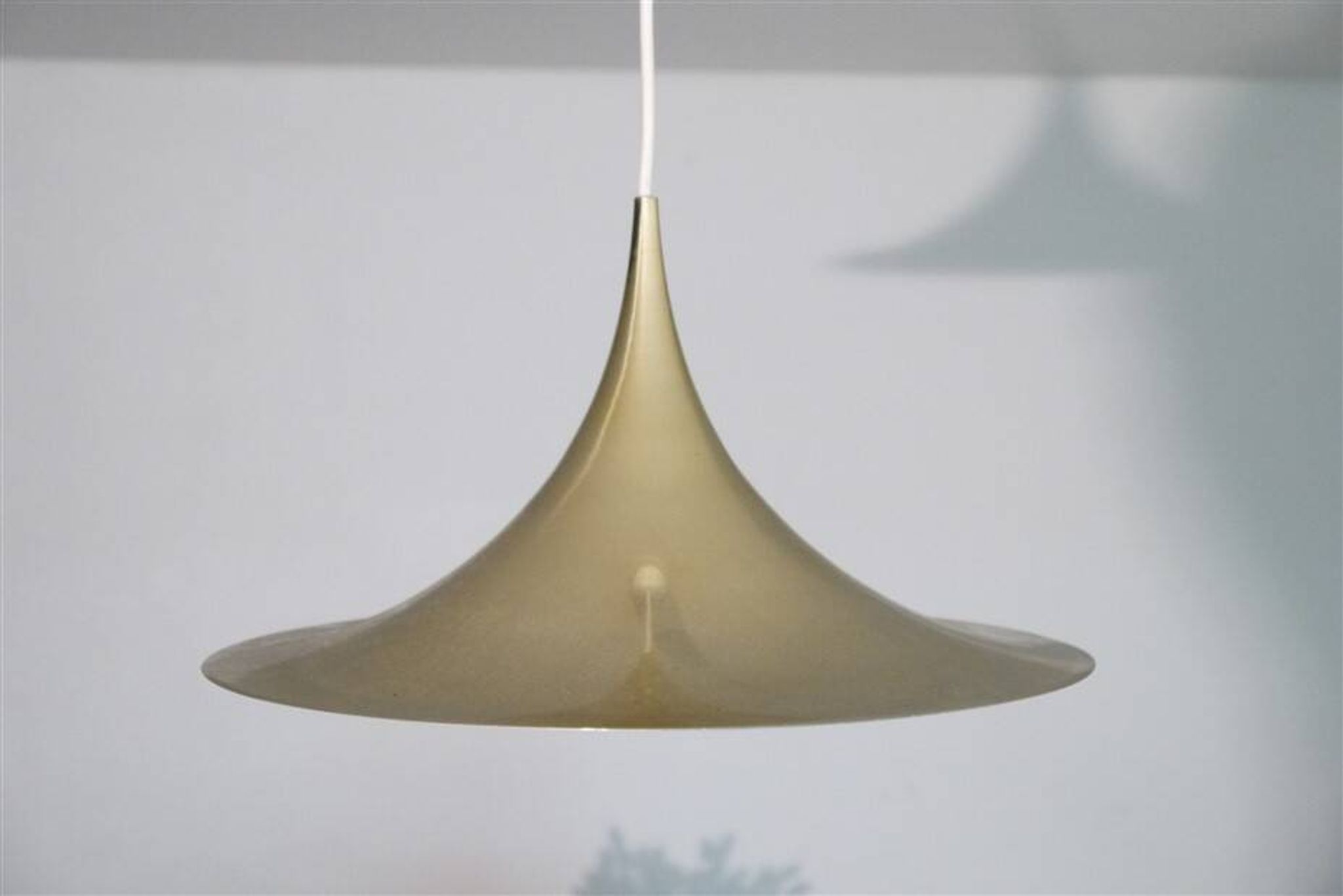 Semi pendulum pendant lamp by Thorup and Bonderup in brass