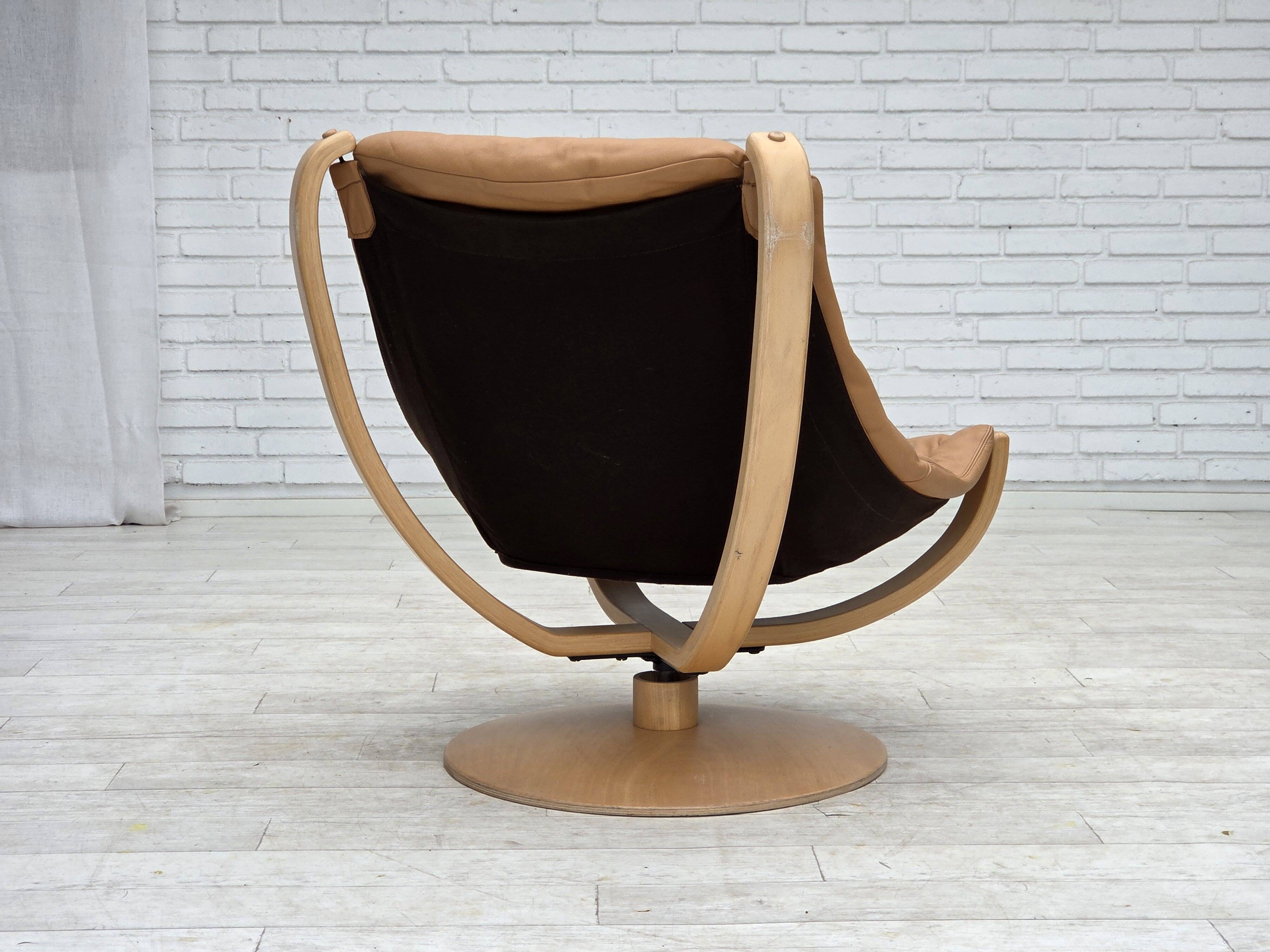 1980s, Scandinavian swivel armchair, furniture leather, bent wood.