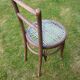 Chair with blue wire braided seat