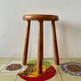 Old solid wood stool with four legs