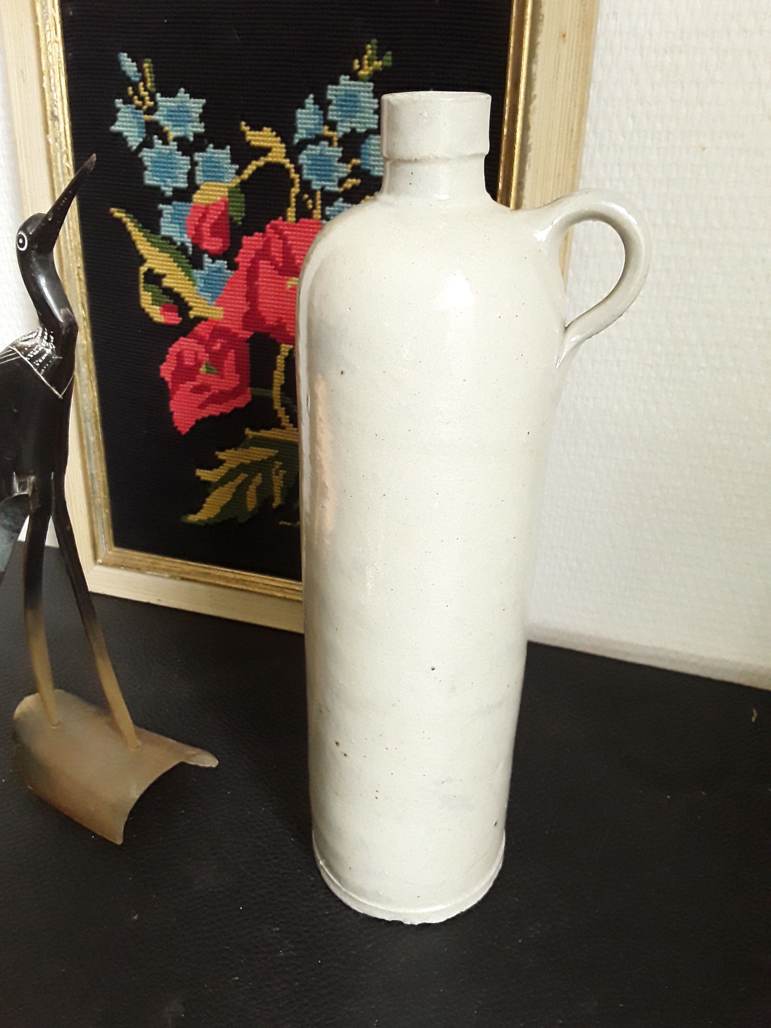 Vintage glazed stoneware bottle with handle
