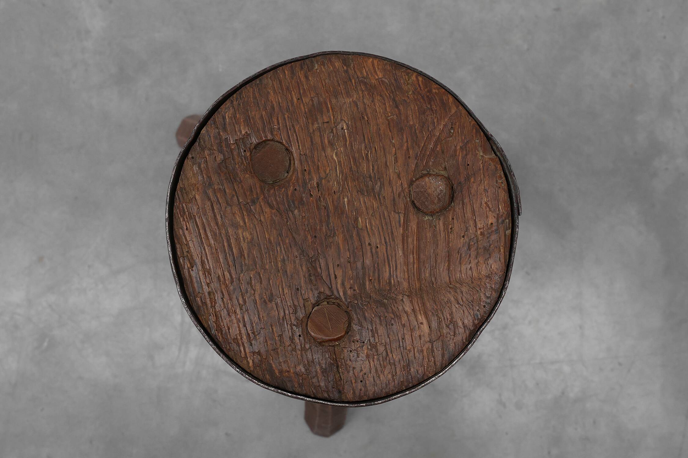 Brutalist French solid oak tripod stool with metal rim, 1850s