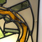 Old stained glass sign with deciduous decoration and microscope