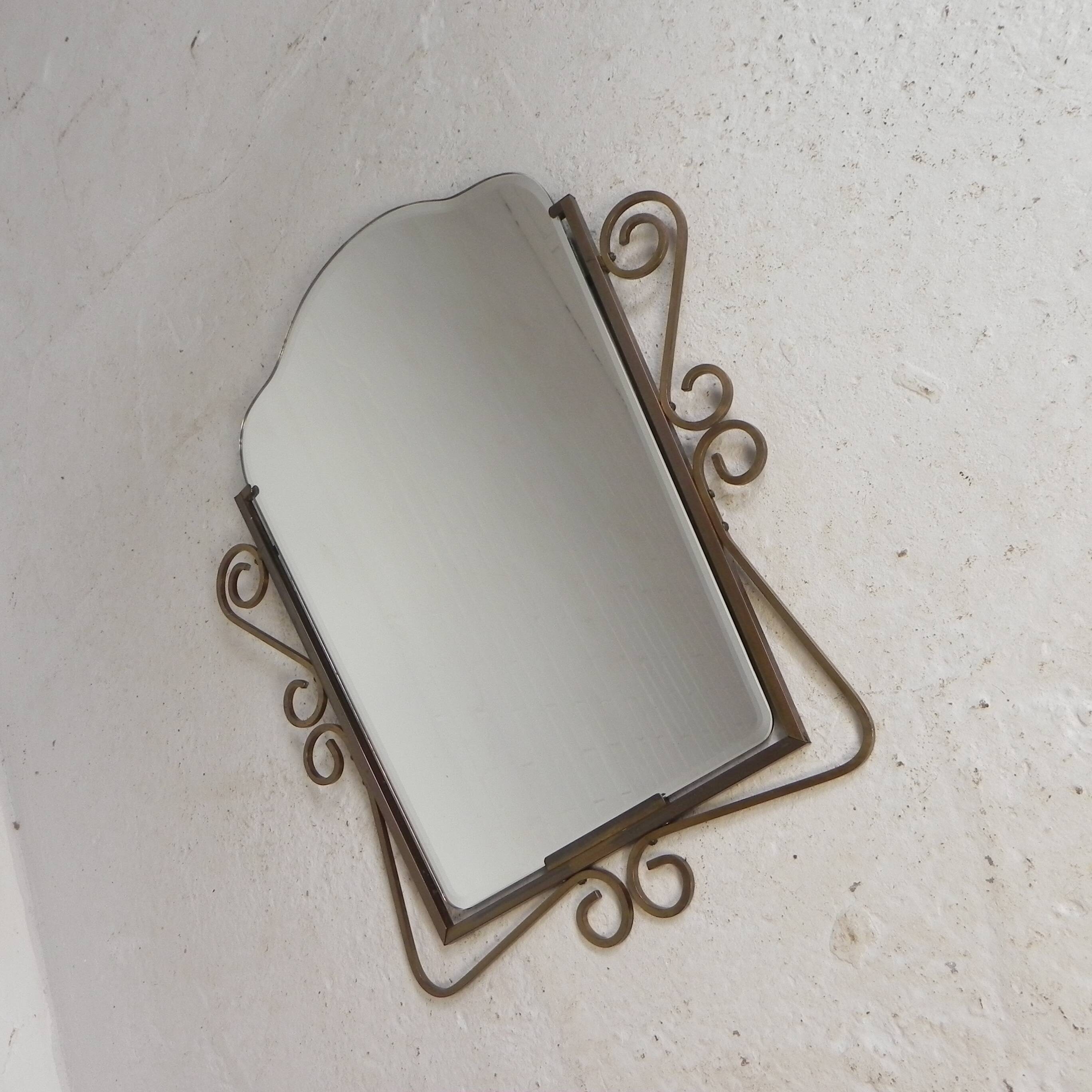 Vintage faceted mirror in a brass frame, 1950s.