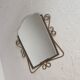Vintage faceted mirror in a brass frame, 1950s.