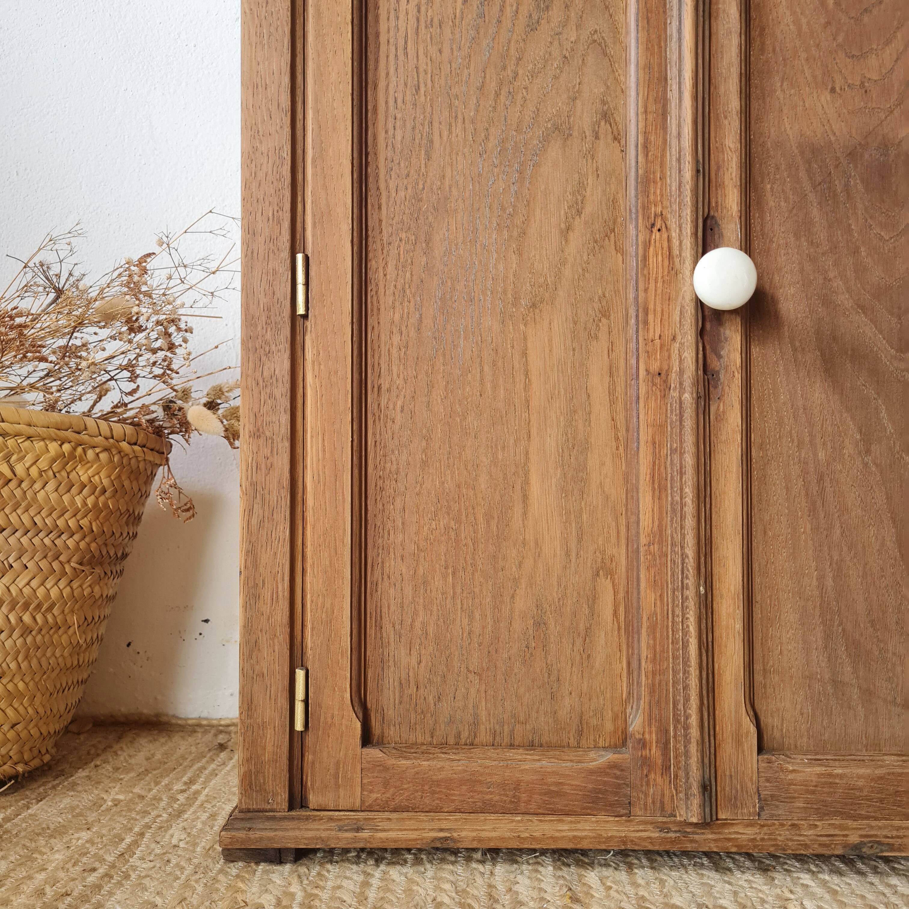 Small Parisian oak wardrobe with its porcelain knob.