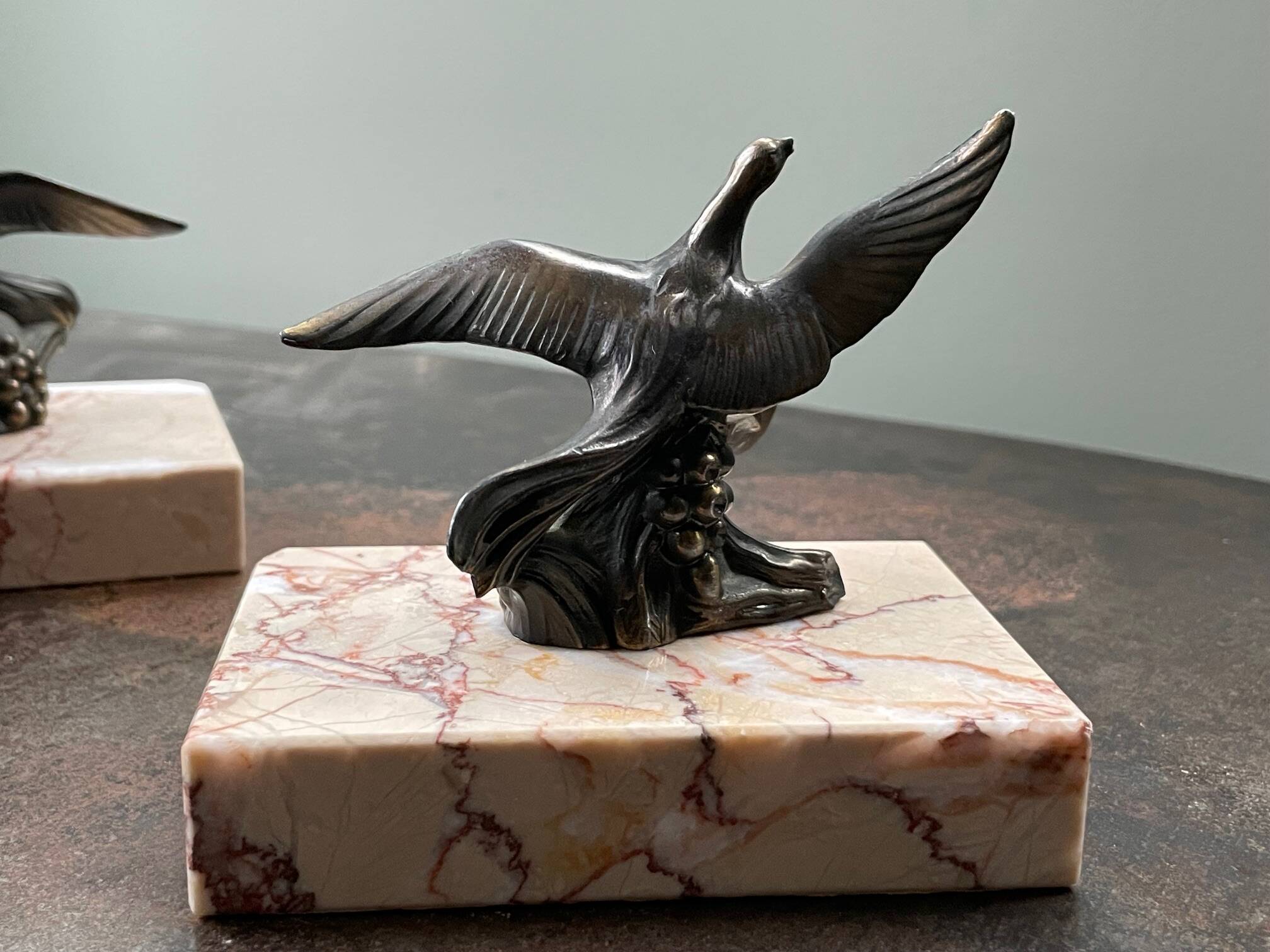 Pair of marble bookends with bronze birds