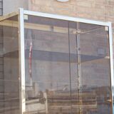 Post-modern low window in brass and smoked glass, 1970s