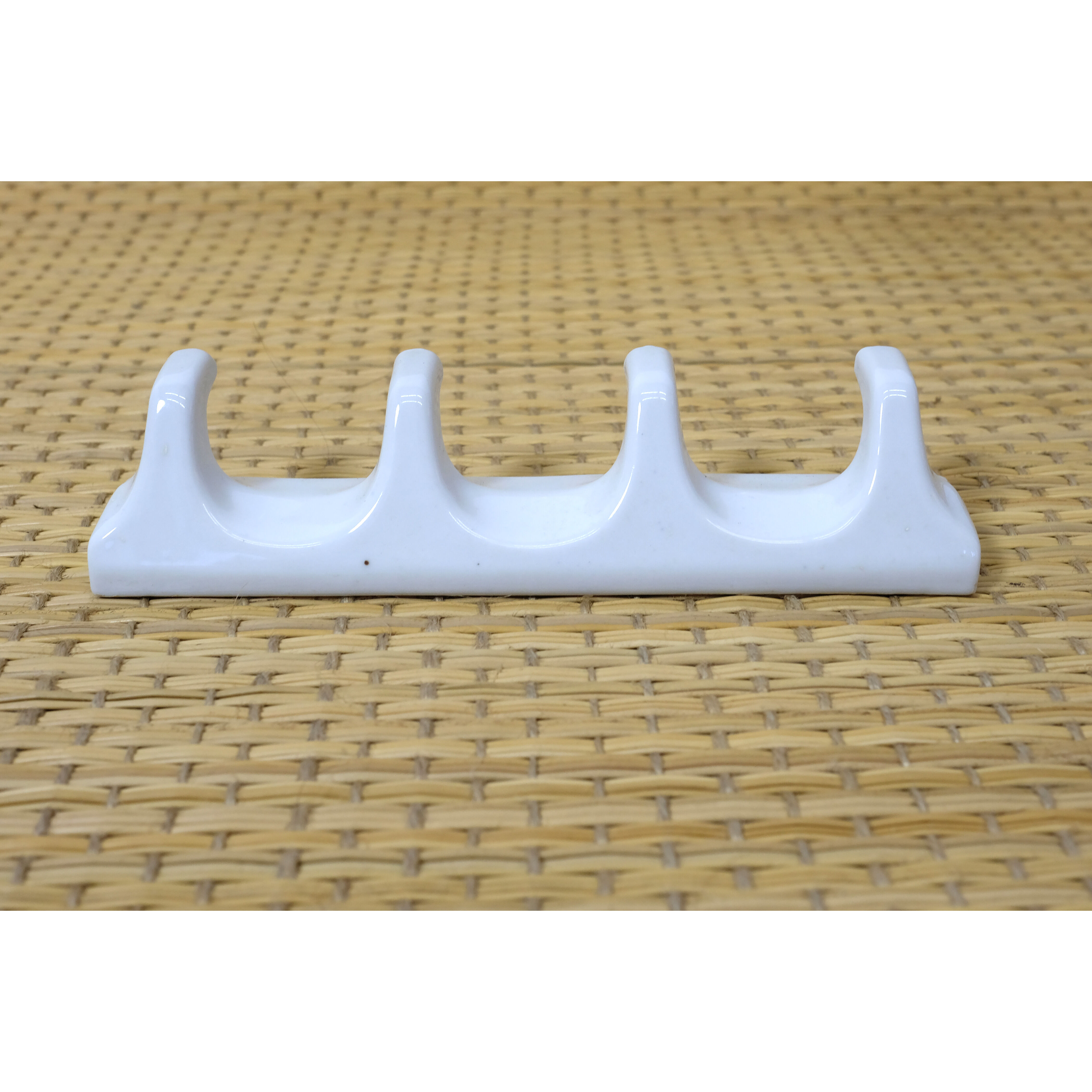 Tea towel holder or porcelain towel with 4 hooks.