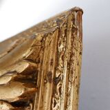 Large gilded wood and stucco mirror with foliage