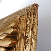 Large gilded wood and stucco mirror with foliage