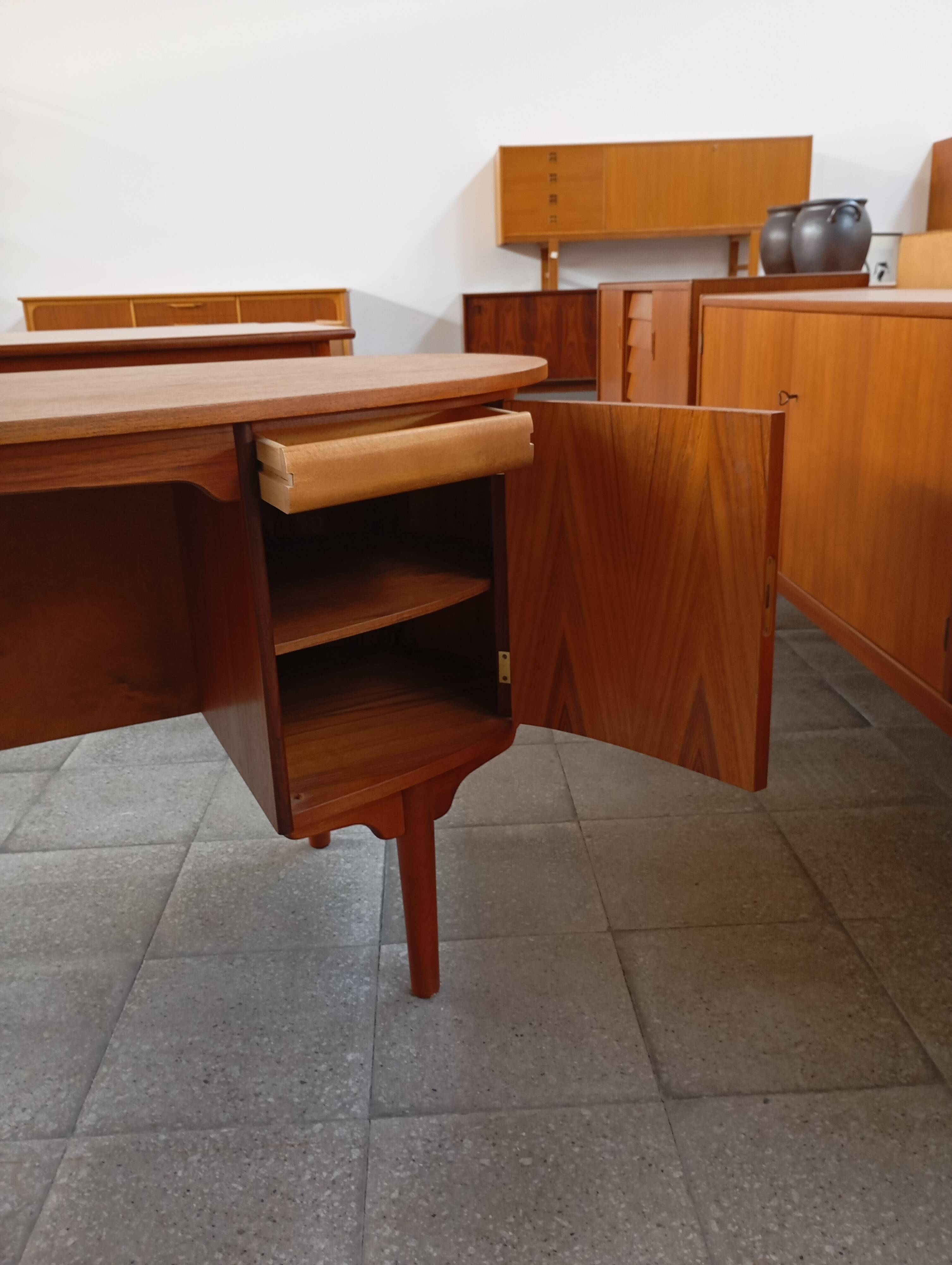 Scandinavian oval desk in teak from the 1960s.