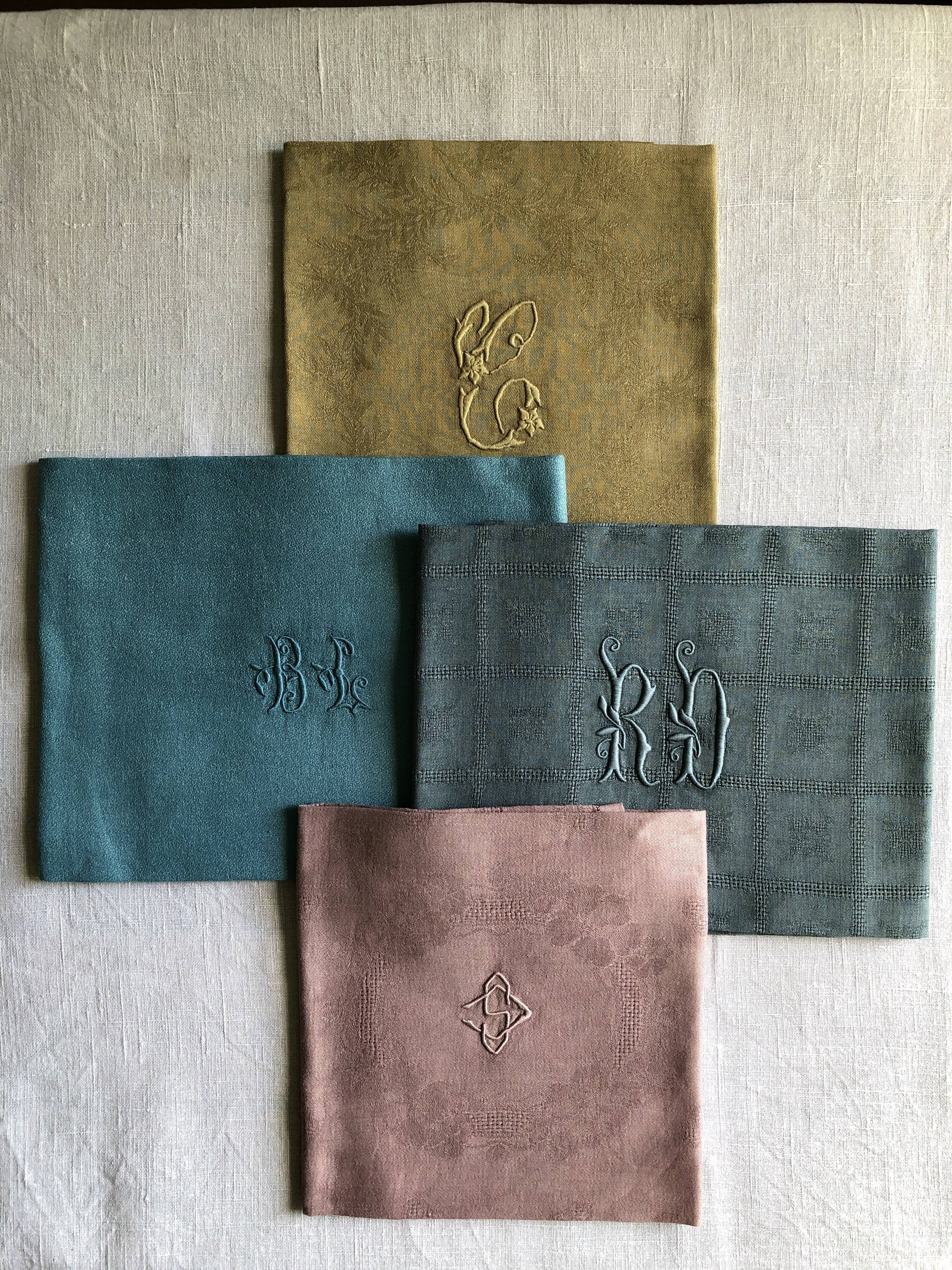 Suite of four tinted antique napkins