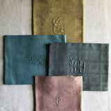 Suite of four tinted antique napkins