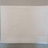 White flat sheet with AG monogram