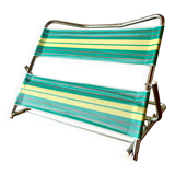 Vintage folding beach chair in chrome metal and woven plastic