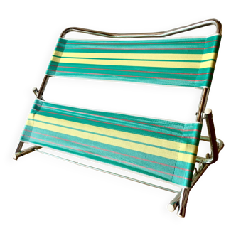 Vintage folding beach chair in chrome metal and woven plastic