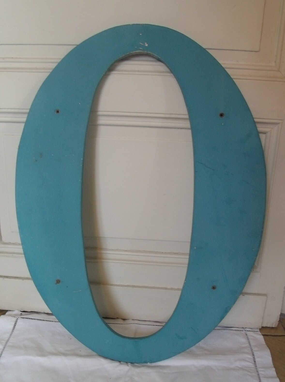 Wooden sign letter O