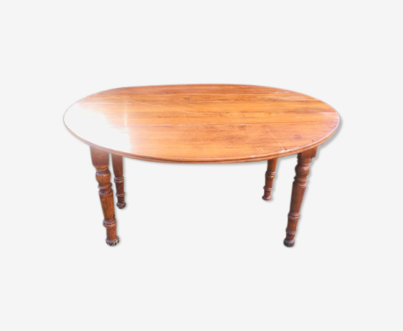 Extendable round table in walnut wood 1930