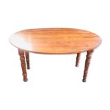 Extendable round table in walnut wood 1930