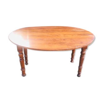 Extendable round table in walnut wood 1930