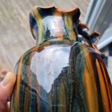 Terracotta vase with a child's head