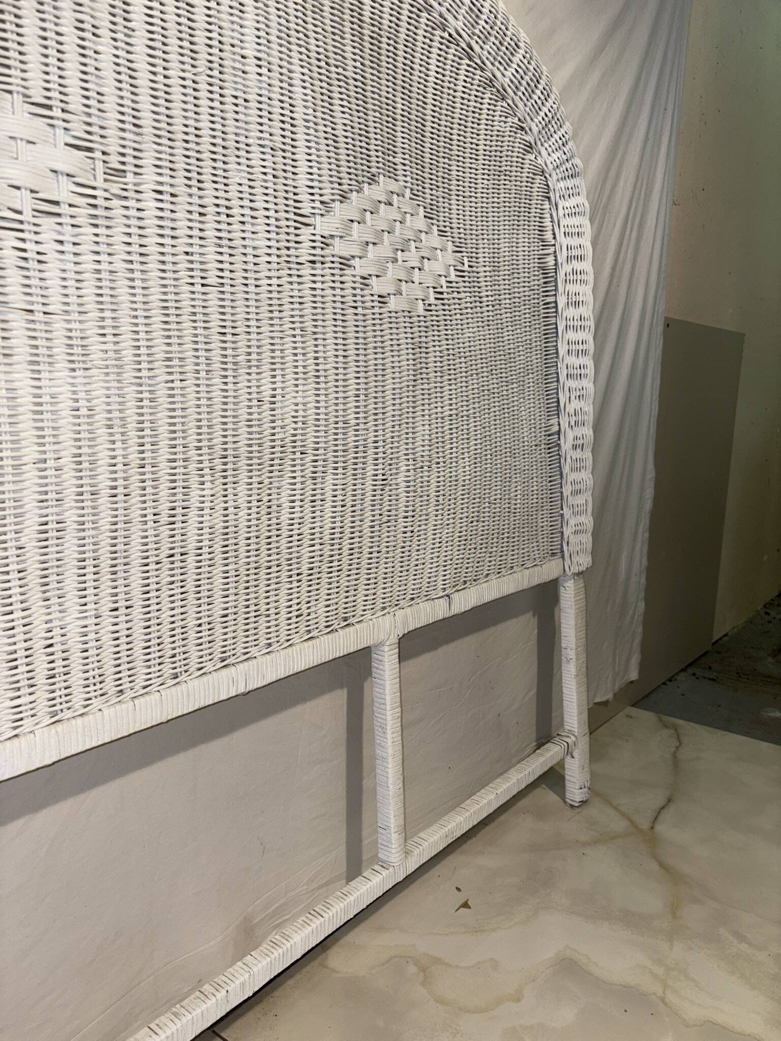 Vintage headboard in woven white rattan