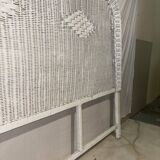 Vintage headboard in woven white rattan