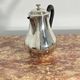Saint Hilaire teapot in silver-plated metal, with a blackened handle.