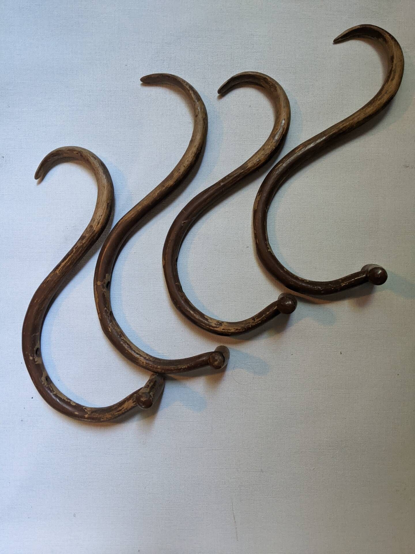 Set of curved wooden coat hooks in Thonet style.