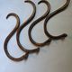 Set of curved wooden coat hooks in Thonet style.