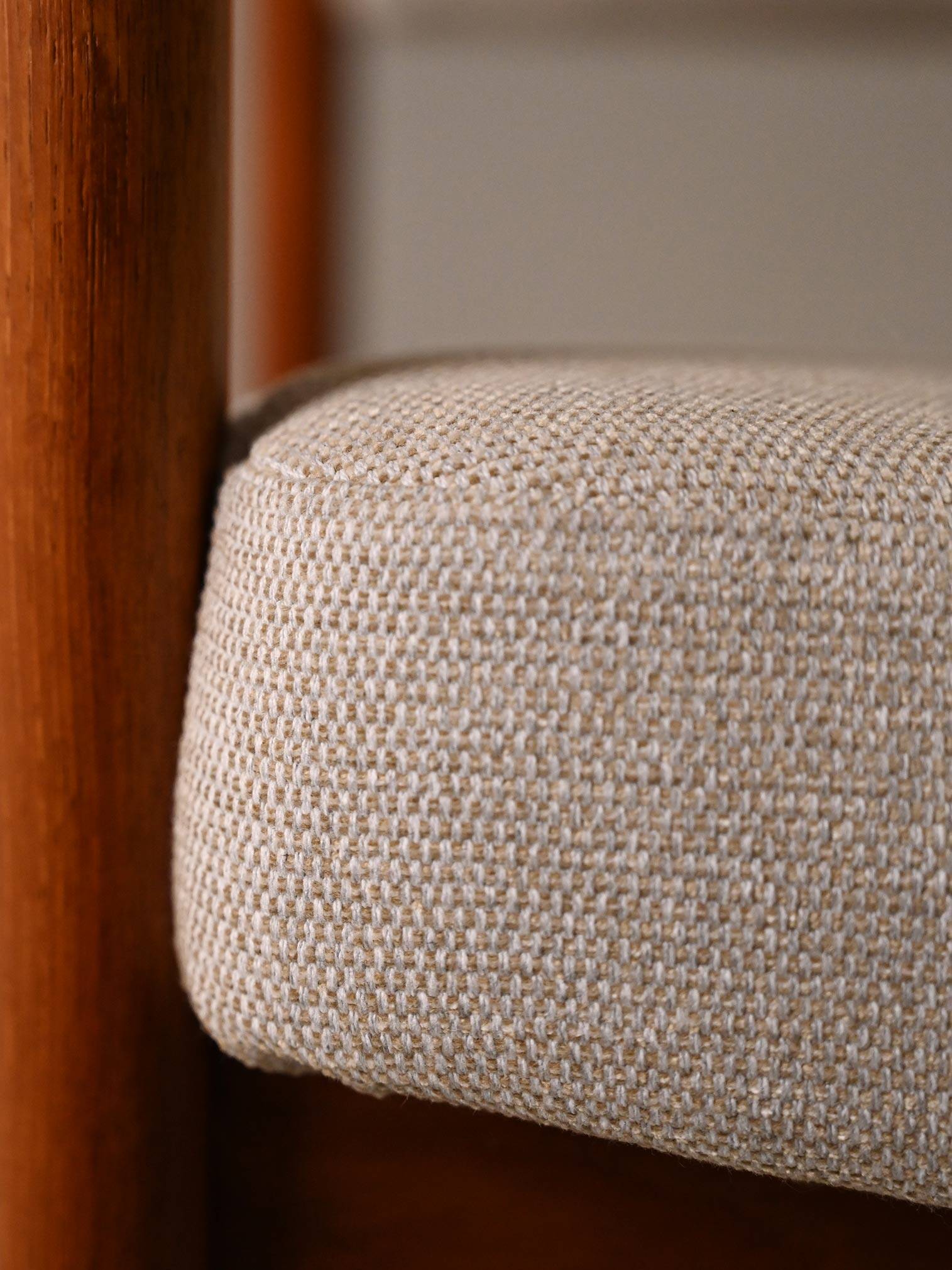 Upholstered armchair with teak frame