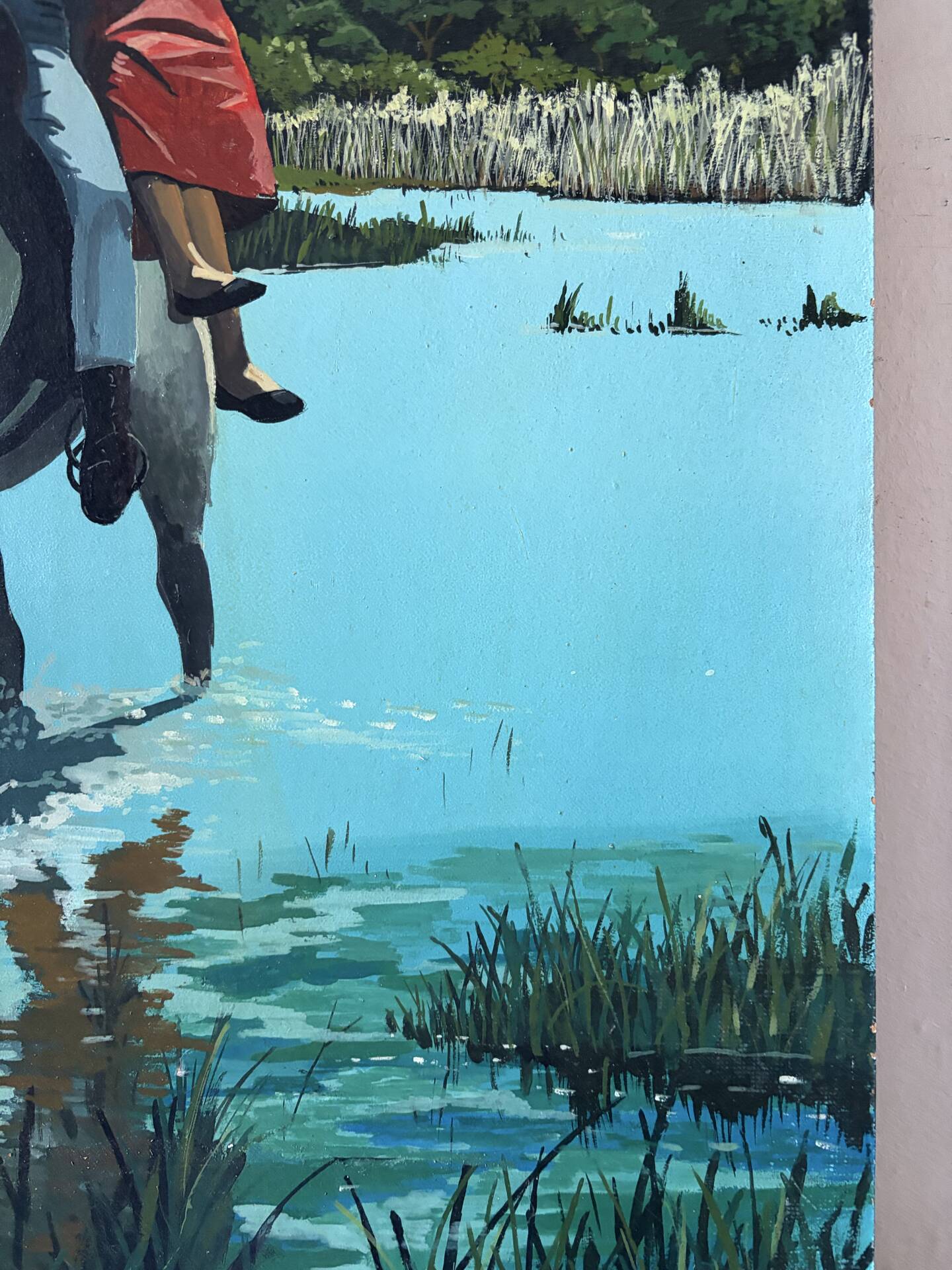 River crossing on horseback, on a sign by Campana.