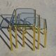 Nested table in gold metal and glass