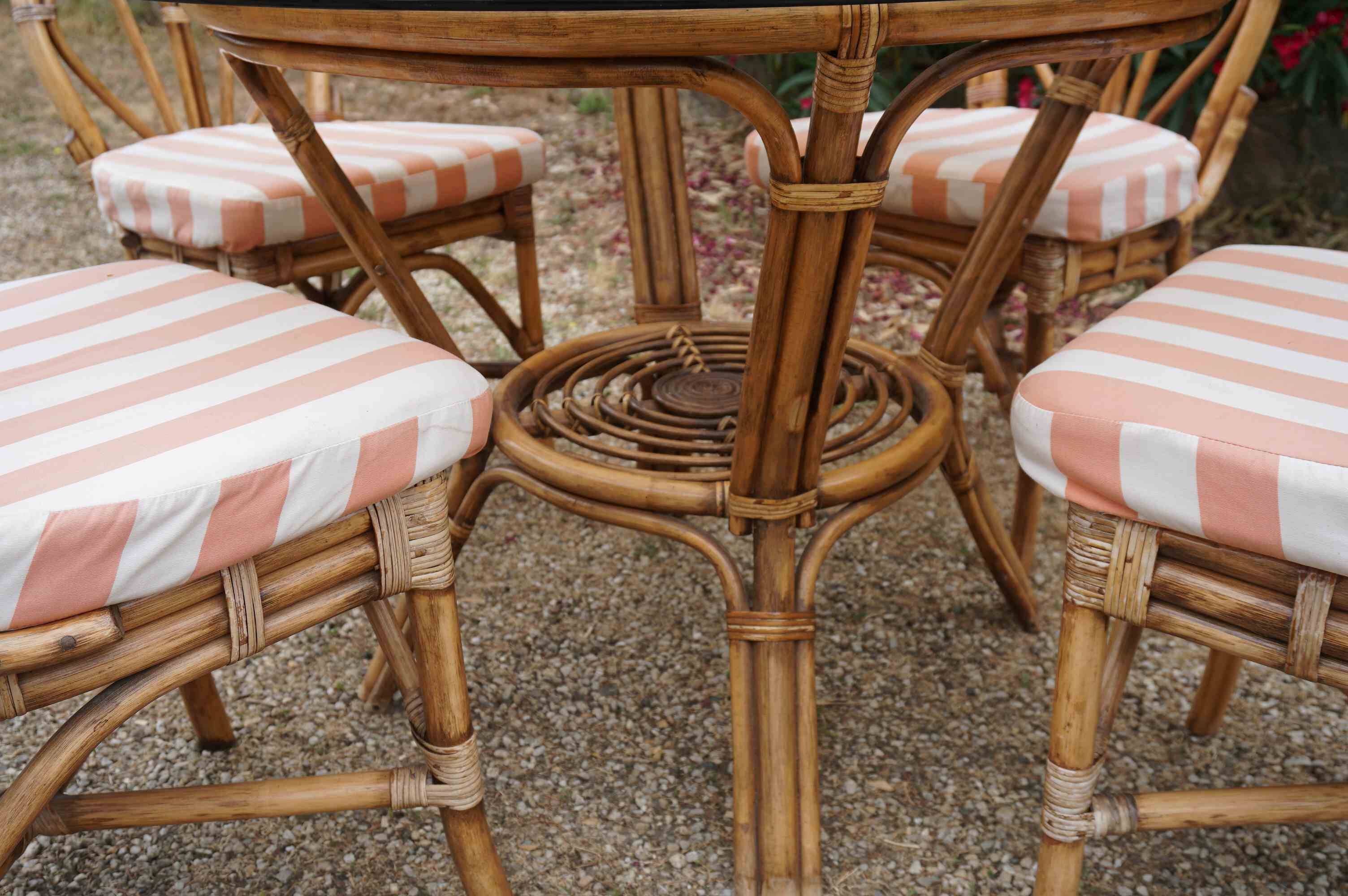 dining table and chairs made of curved bamboo and rattan with smoked glass from the 1970s