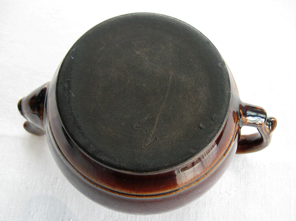 Old brown glazed ceramic coffee pot