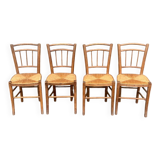 four vintage bistro-style straw chairs