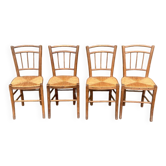 four vintage bistro-style straw chairs