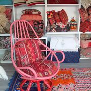Restored vintage 70s armchair with custom-made Moroccan cushions, pink and red armchair