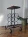 Side table, brutalist bottle holder in wrought iron and solid wood.
