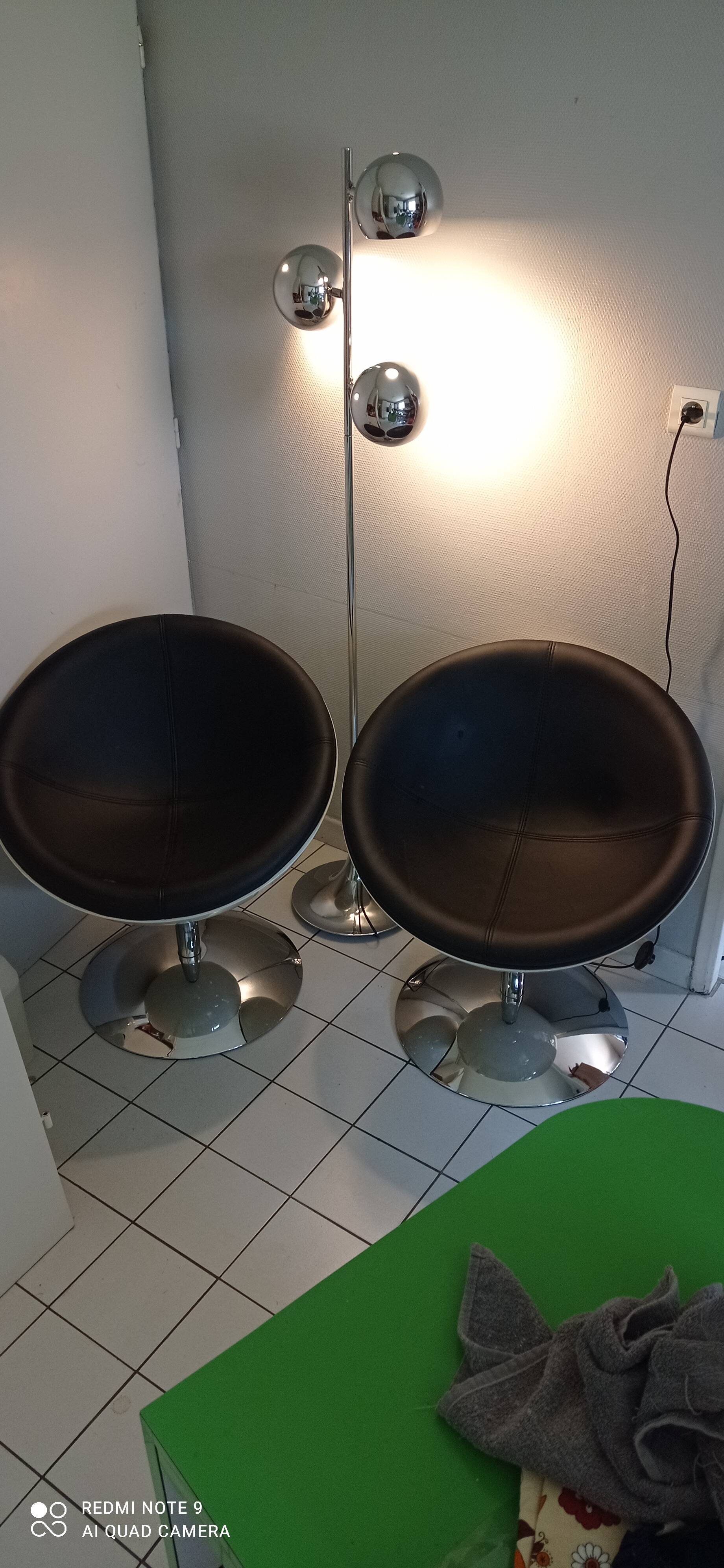 Pair of vintage white ball and black imitation leather swivel armchairs