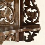Carved wooden wall shelf