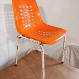 Chair with openwork plastic shell 1970