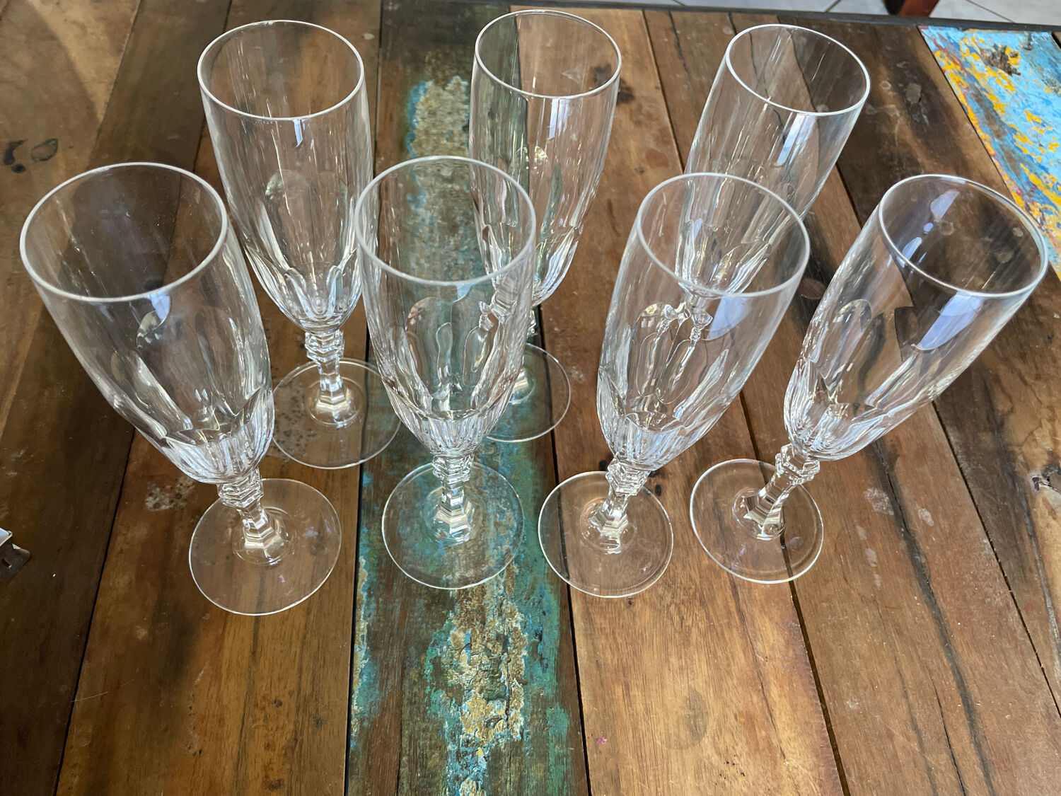 Set of 7 champagne flutes. Made of cut crystal.